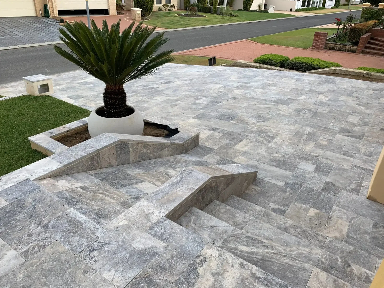 What is the best material to put between travertine pavers