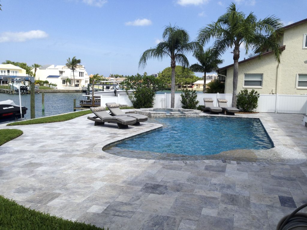 Does putting sand between pavers stop weeds